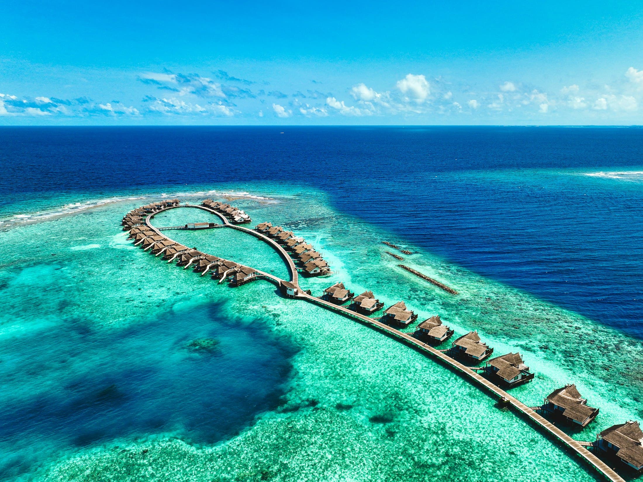 Aerial view of overwater villas in the Maldives