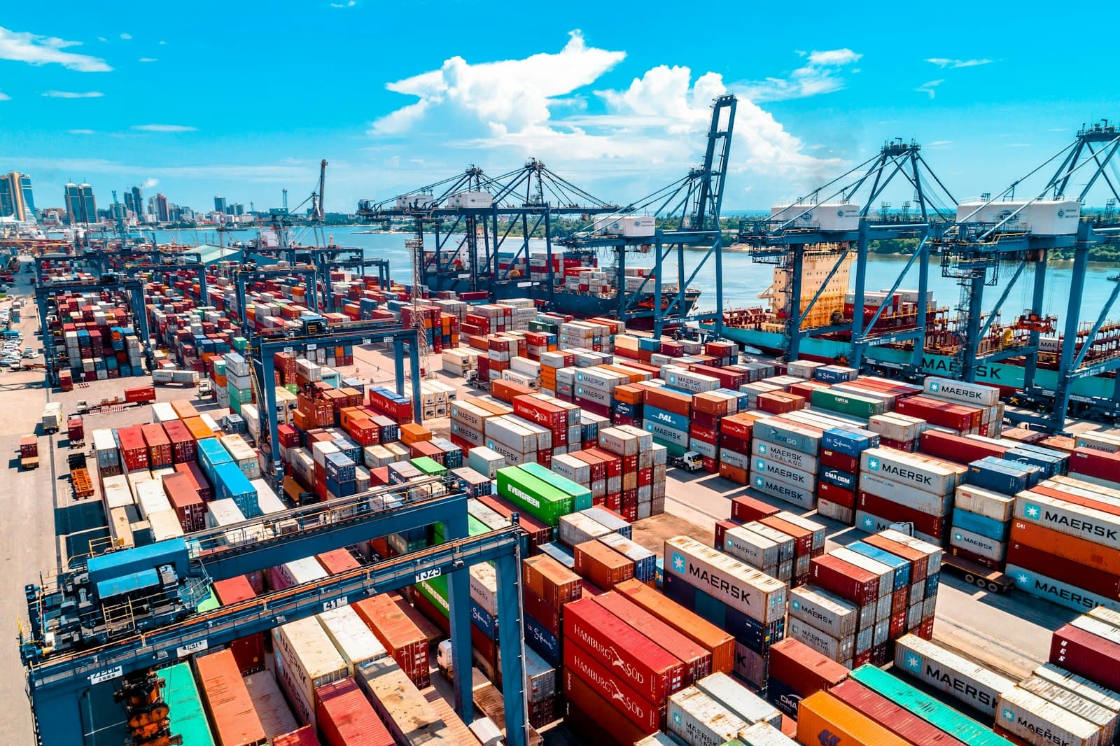 Container terminal with cranes and stacked shipping containers